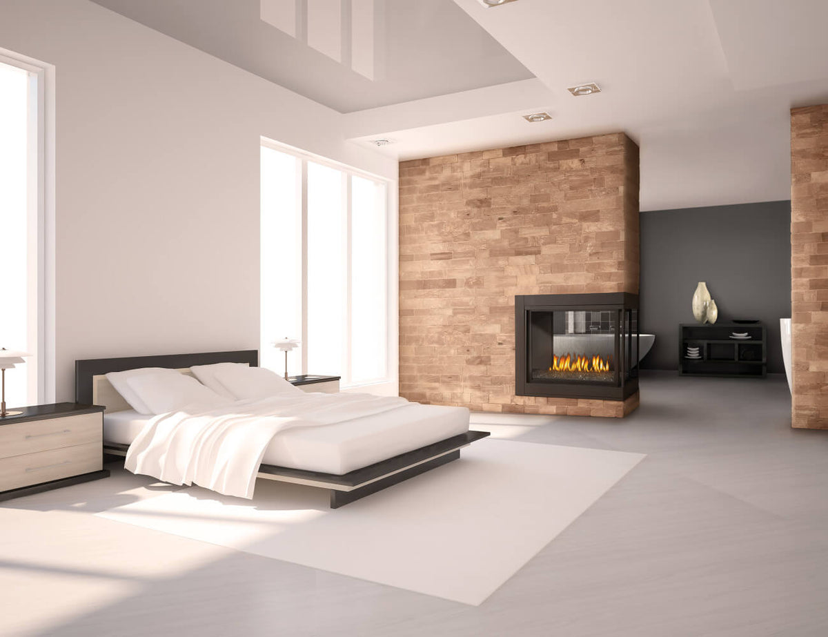 Modern bedroom with a bed, nightstands, and a fireplace.