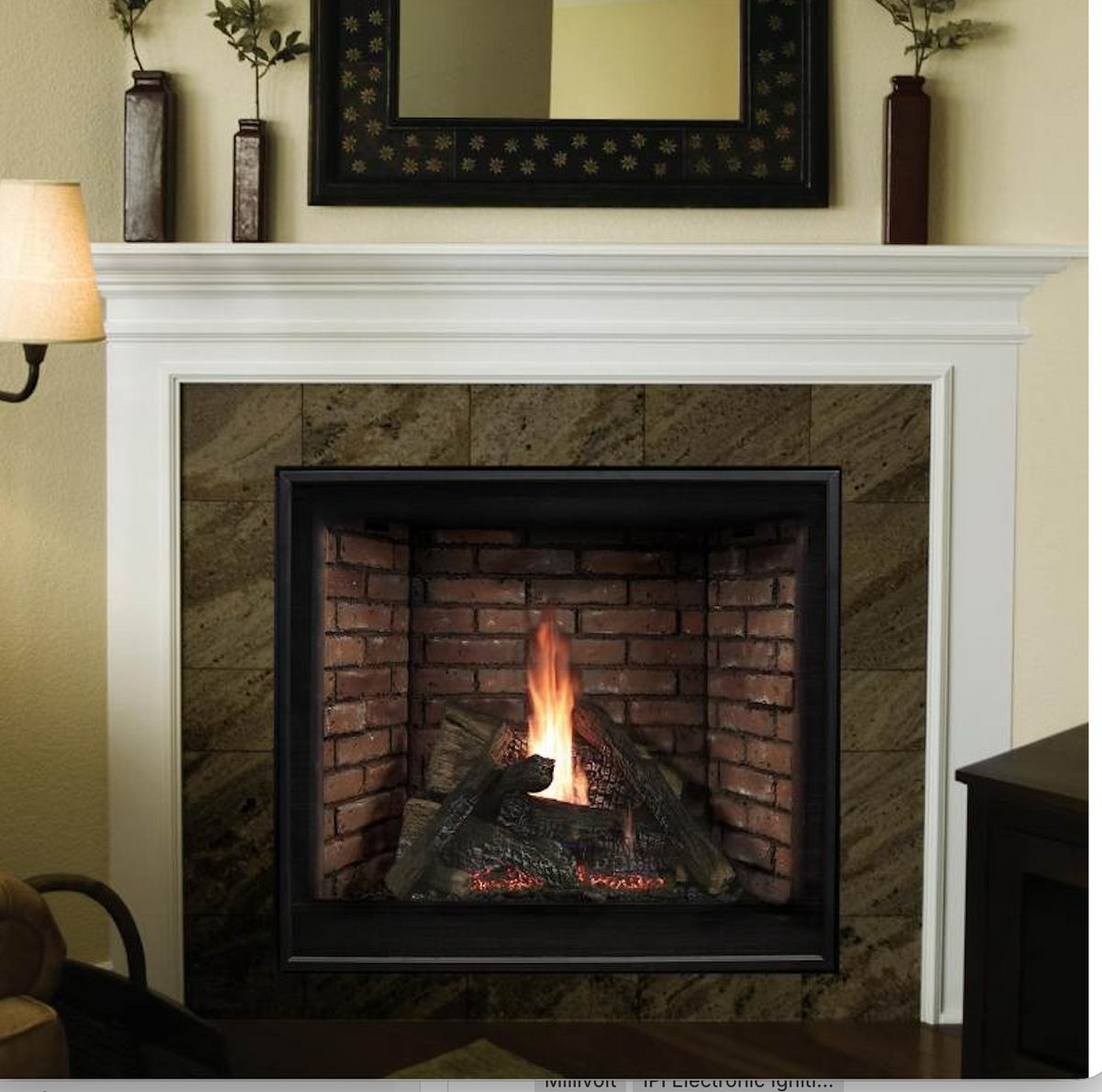 A gas fireplace insert with a black frame and realistic brick and log design, set within a white fireplace mantel in a living room setting.