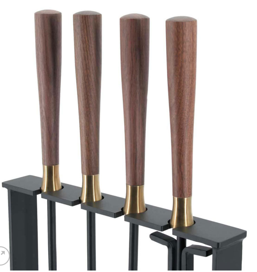 Close up of the walnut wood handles and brass tool set