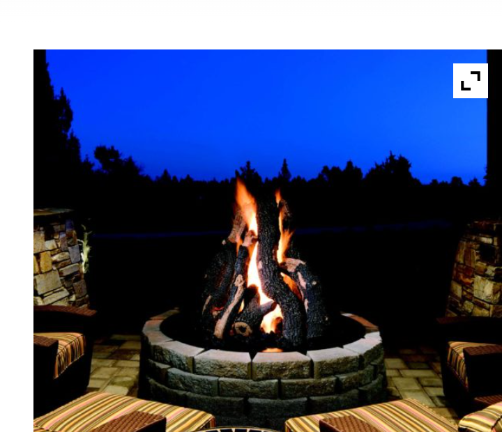evening setting featuring a burning fame within a brick surround