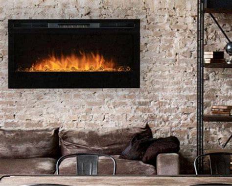 fireplace built into a stone wall in living room with black background