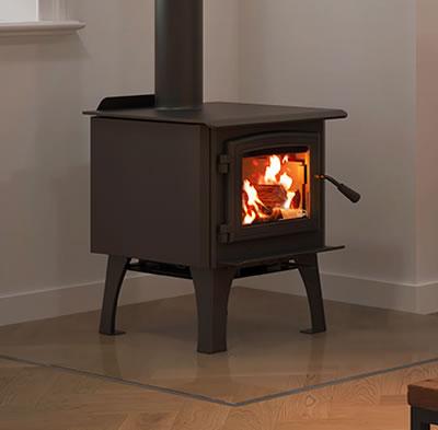 Osburn stove with woodburning flame in a white room