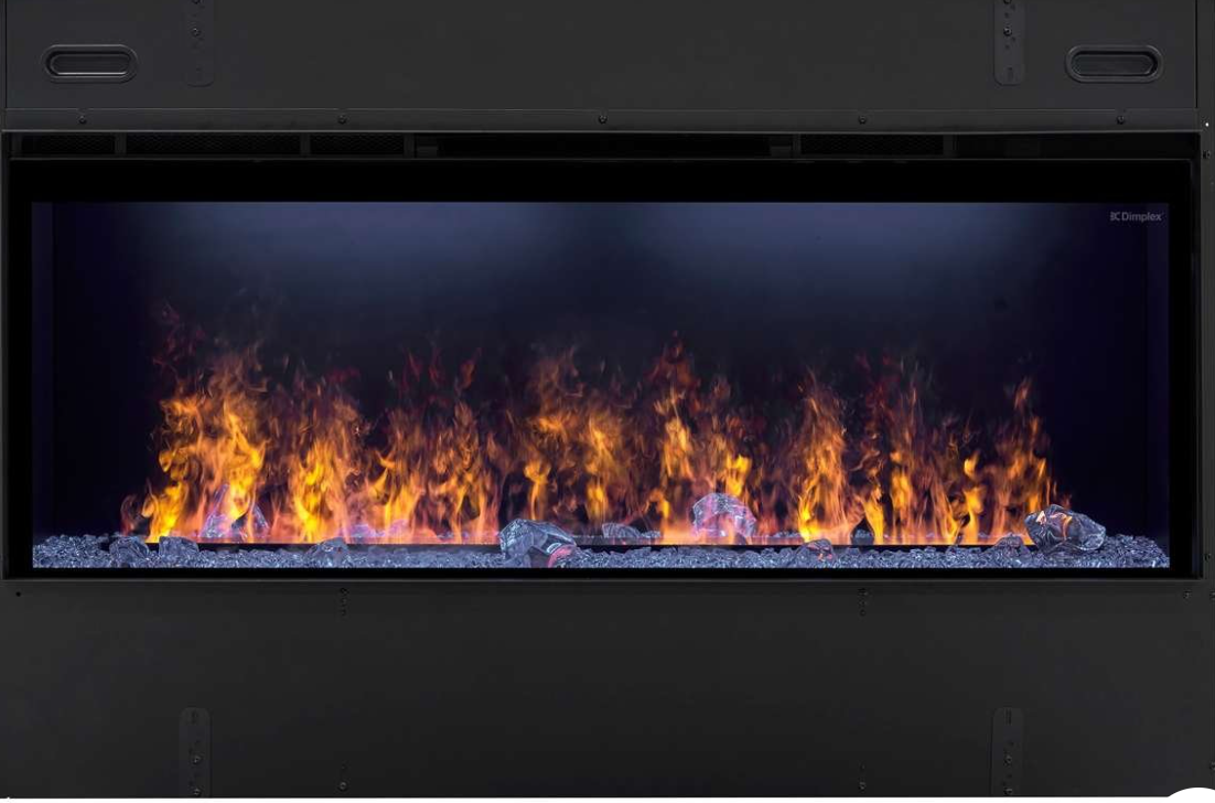 A wide, modern electric fireplace insert with a black frame, featuring realistic orange and yellow flames dancing over gray faux rocks inside a dark glass front.