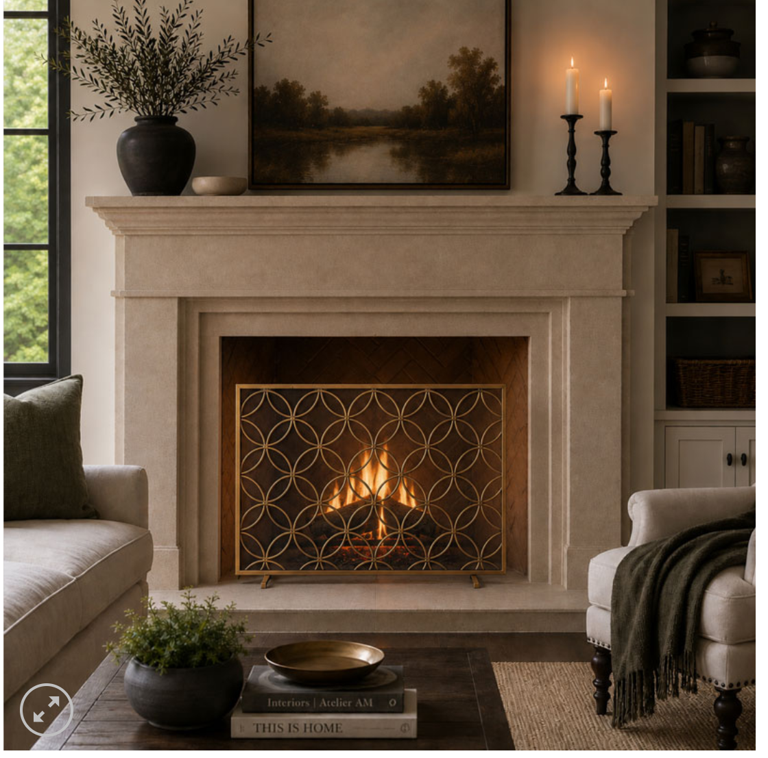 Living room with fireplace and gold screen in front of burning fire