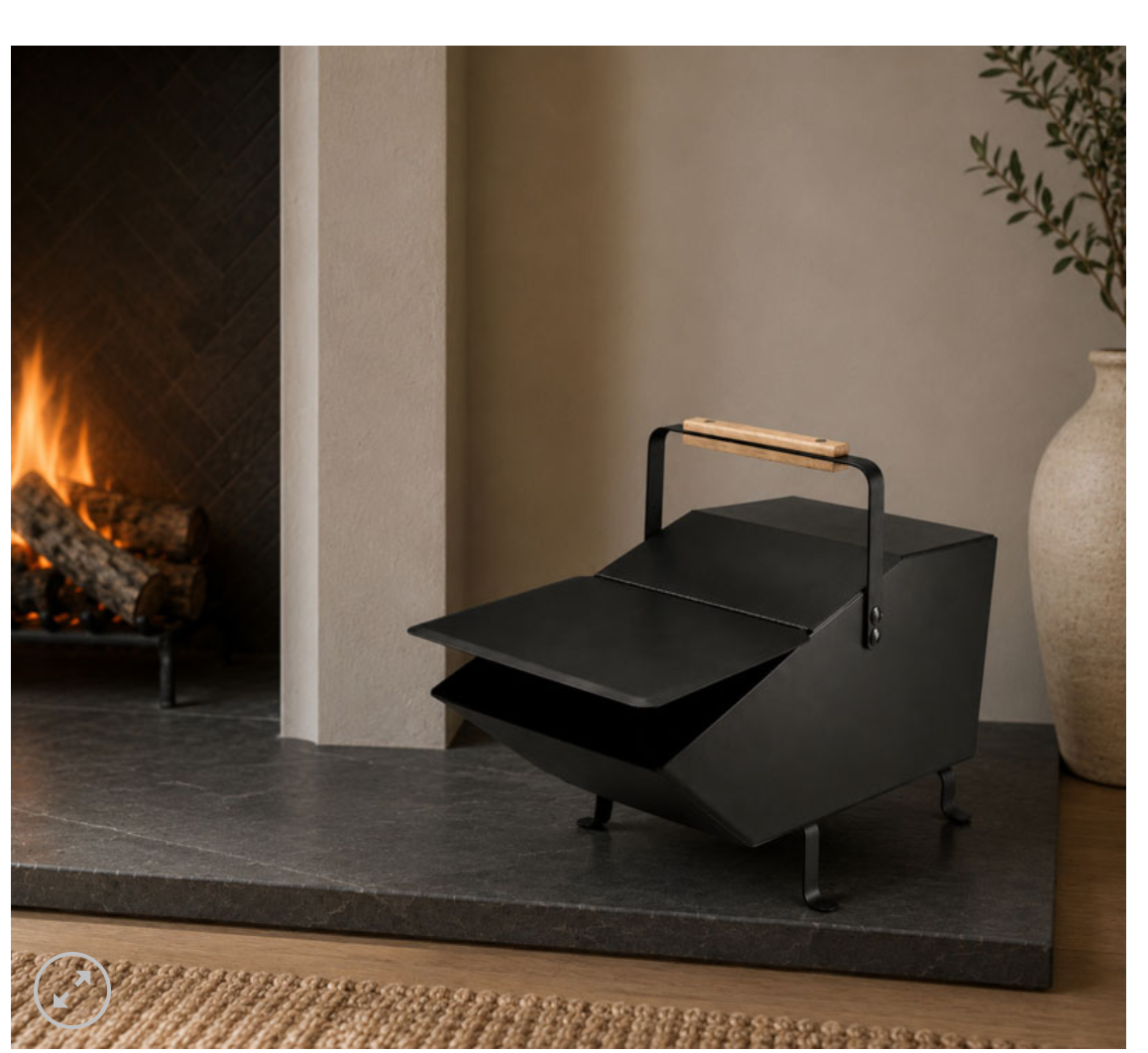 Matte Black ash holder beside a fireplace