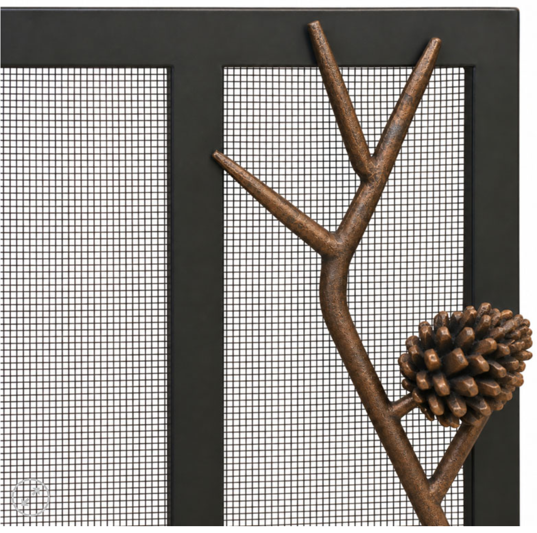 Close up of pine cone fireplace screen on white background