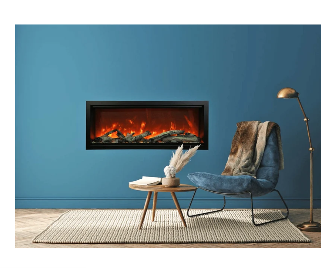 fireplaced built into a blue wall with a chair and table and light in the room