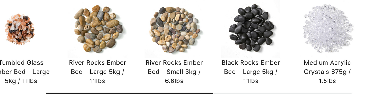 Five types of decorative aquarium gravel shown in small piles with labels underneath: Fumbled Glassiber Bed Large 5kg / 11lbs, River Rocks Ember Bed Large 5kg / 11lbs, River Rocks Ember Bed Small 3kg / 6.8lbs, Black Rocks Ember Bed Large 5kg / 11lbs, and Medium Acrylic Crystals 675g / 1.