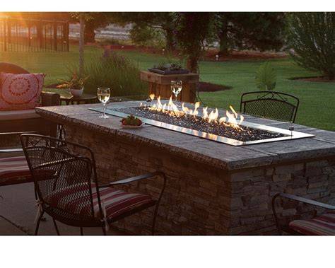 Fire table outdoors with chairs around the table